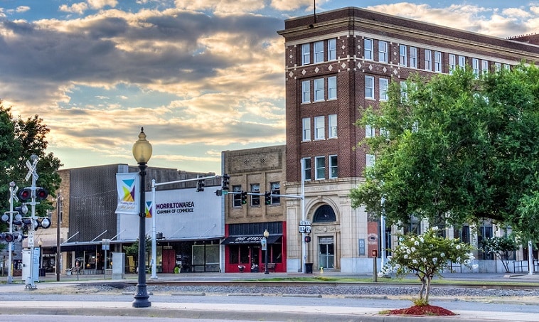 A line of store fronts and a tall bank building in downtown Morrilton.